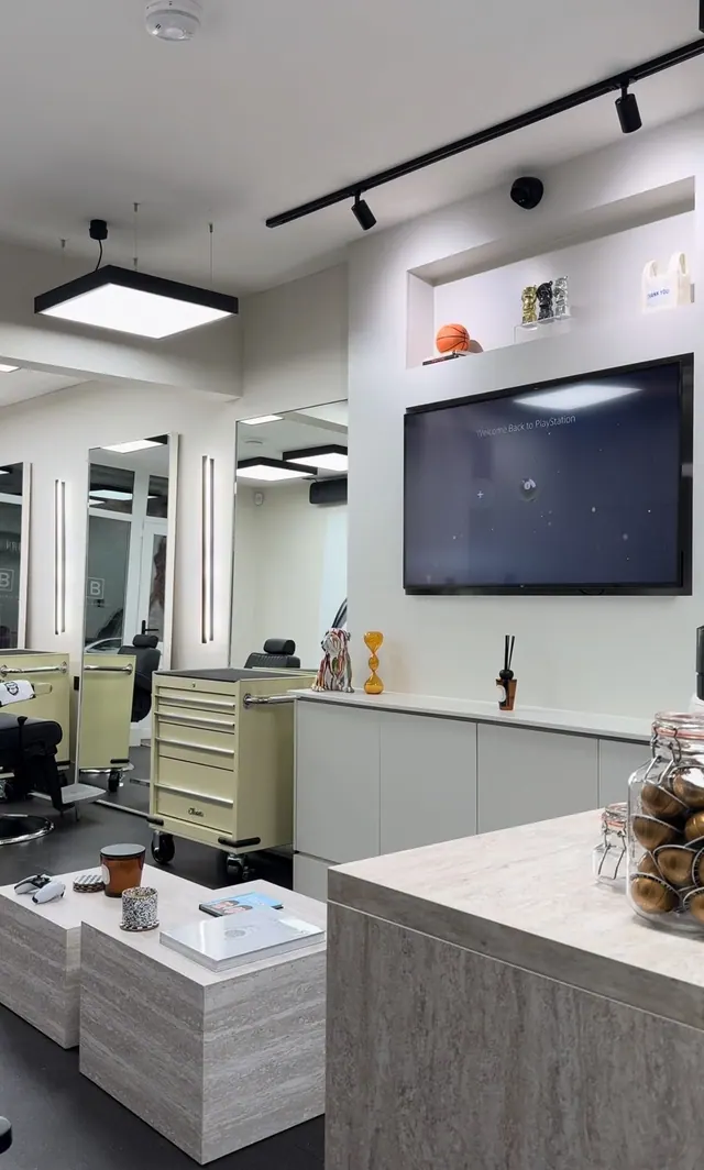 The mirrors, screen and counter at Lincoln's Barbers